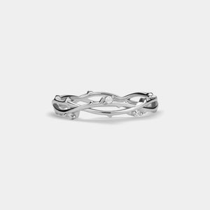 Silver ring with a diamond on a light gray background