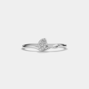 Silver ring with a heart-shaped diamond on a light gray background