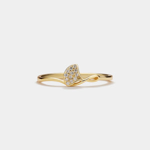 Gold ring with a heart-shaped diamond on a white background