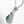 Necklace with a green gemstone pendant on a white background