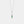 Necklace with a green teardrop pendant on a white background