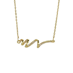 Gold necklace with a wavy design on a white background