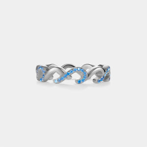 Silver ring with blue gemstones on a white background