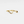 Gold ring with a wavy design and small diamonds on a light gray background