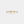 Gold ring with wavy design on a white background