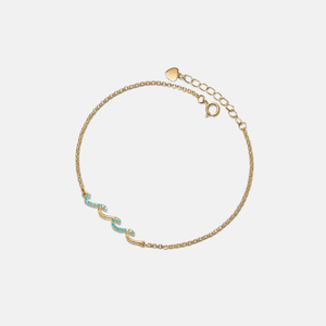 A two-tone gold-plated sterling silver bracelet with a geometric pattern and a central charm.