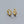 A collection of hoop earrings in various sizes, with some plated in gold and others in silver, all featuring cubic zirconia.