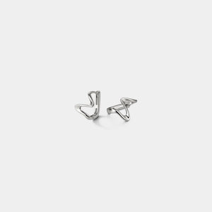 Pair of silver earrings on a light gray background