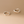 Pair of gold hoop earrings on a beige background