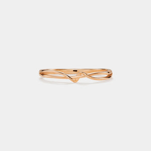 Rose gold bracelet on a light gray background