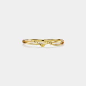 Gold ring with a twisted design on a white background