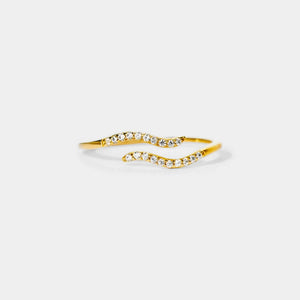 Gold open bangle with crystal stones on a white background