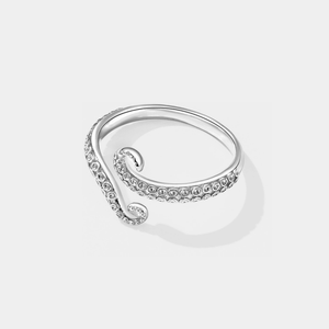 Silver octopus ring on a light gray background