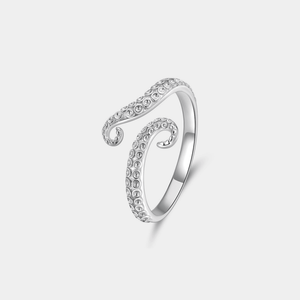 Silver octopus ring on a light gray background