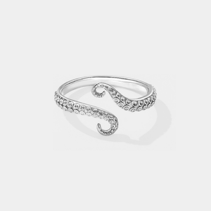 Silver octopus ring on a light gray background