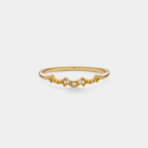Gold ring with small diamonds on a white background