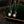 Two necklaces with star and moon pendants on a dark background