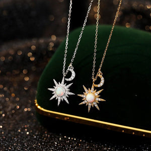 Two necklaces with star and moon pendants on a dark background
