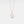 A gold-plated necklace with a solid 925 sterling silver circular charm featuring an opal tulip flower design, with cubic zirconia accents.