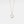 A gold-plated necklace with a solid 925 sterling silver circular charm featuring an opal tulip flower design, with cubic zirconia accents.