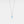 Necklace with a blue gemstone pendant on a light gray background