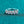 Silver ring with five diamonds on a teal background