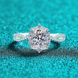 Diamond ring on a teal glittery background