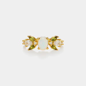 Gold earrings with opal and green gemstones on a white background