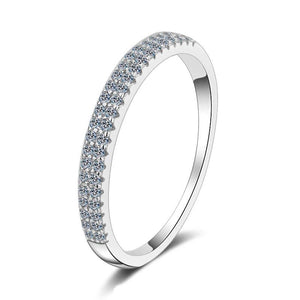 Silver ring with small diamonds on a white background