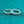 Pair of silver hoop earrings with small diamonds on a teal glitter background