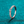 Rose gold ring with diamonds on a teal background