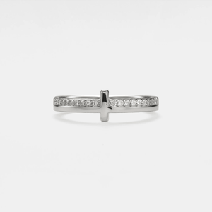 A gold-plated sterling silver stacking ring with a pave setting cross design, featuring cubic zirconia.