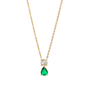 Gold necklace with a green teardrop pendant and clear gemstone on a white background
