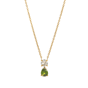 Gold necklace with a green teardrop pendant and clear gemstone on a white background