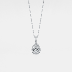 Teardrop-shaped moissanite pendant on a chain against a light gray background