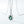 Silver pendant with a green gemstone on a white background