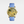 Watch with gold case and blue leather strap on a white background