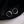 Pearl hoop earrings on a black fabric background