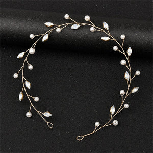 Delicate pearl and crystal hair vine on a black background