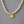 A collection of three pearl necklace chains with gold-plated rose flower pendants, displayed on a grey background.