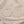 Two floral anklets, one silver and one gold, on a beige fabric background.