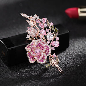 Decorative brooch with pink gemstones on a black background