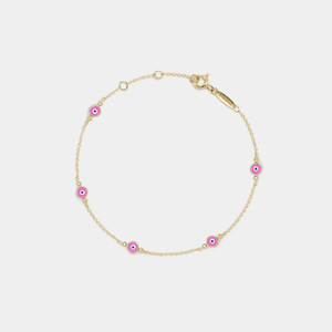 A gold-plated sterling silver bracelet with pink enamel evil eye charms on a white background.