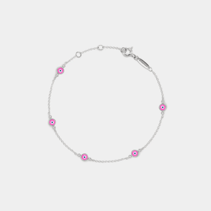 A gold-plated sterling silver bracelet featuring multiple small pink enamel charms designed to resemble evil eyes, set on a white background.