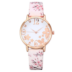 Watch with floral design on strap and face on white background