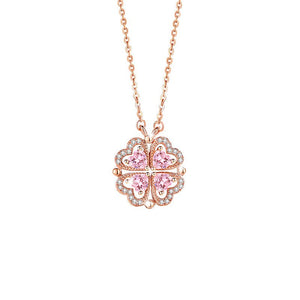 Rose gold necklace with a pink clover-shaped pendant on a white background