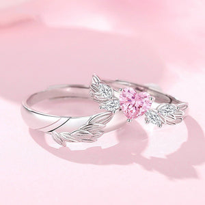 Silver ring with pink gemstone on a pink background