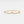 Gold bracelet with pink heart-shaped gemstone on a white background