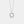 Silver geometric pendant necklace on a light gray background