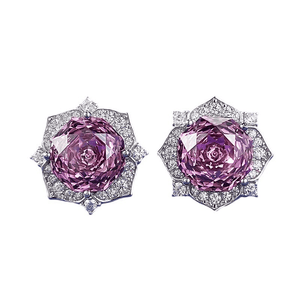 Pair of pink gemstone earrings with diamond accents on a white background
